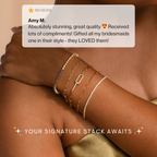 A hand wears five gold beaded bracelets, including adjustable Must-Have Bracelet Chains, with a positive review and the message: Your Signature Stack Awaits.