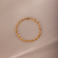 Mini Mariner Chain Bracelet in gold with rounded mariner-style links, placed on a neutral background.