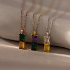 The Duo Birthstone Name Necklace features three gemstone pendants in rose gold, gold, and silver. Personalize each with custom name engraving to create your own unique keepsake.