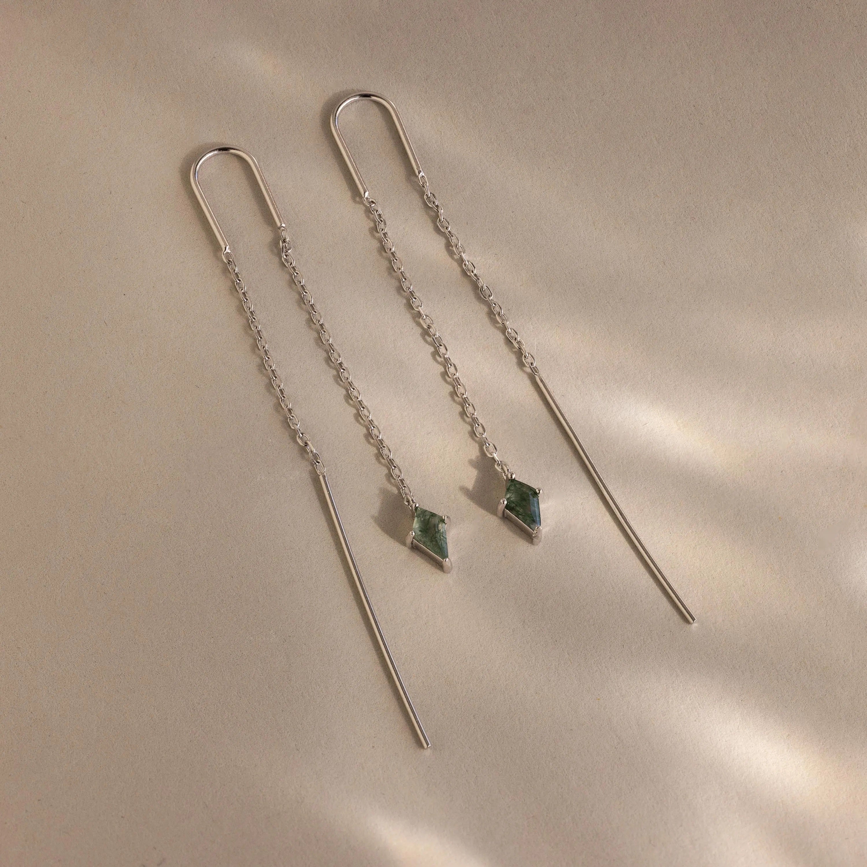Agate Threader Earrings featuring green moss agate gemstone dangles, shown on a neutral beige background—modern earrings ideal for any occasion.