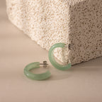 Close-up of Jade Hoop Earrings in silver, featuring a chunky hoop design with green jade and butterfly back closures.