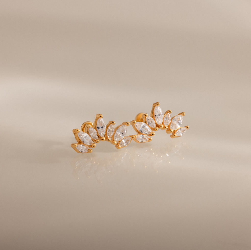Marquise Diamond Arc Climbers in 18K Gold featuring leaf-shaped marquise stones arranged in a graceful arc, displayed on a neutral background.