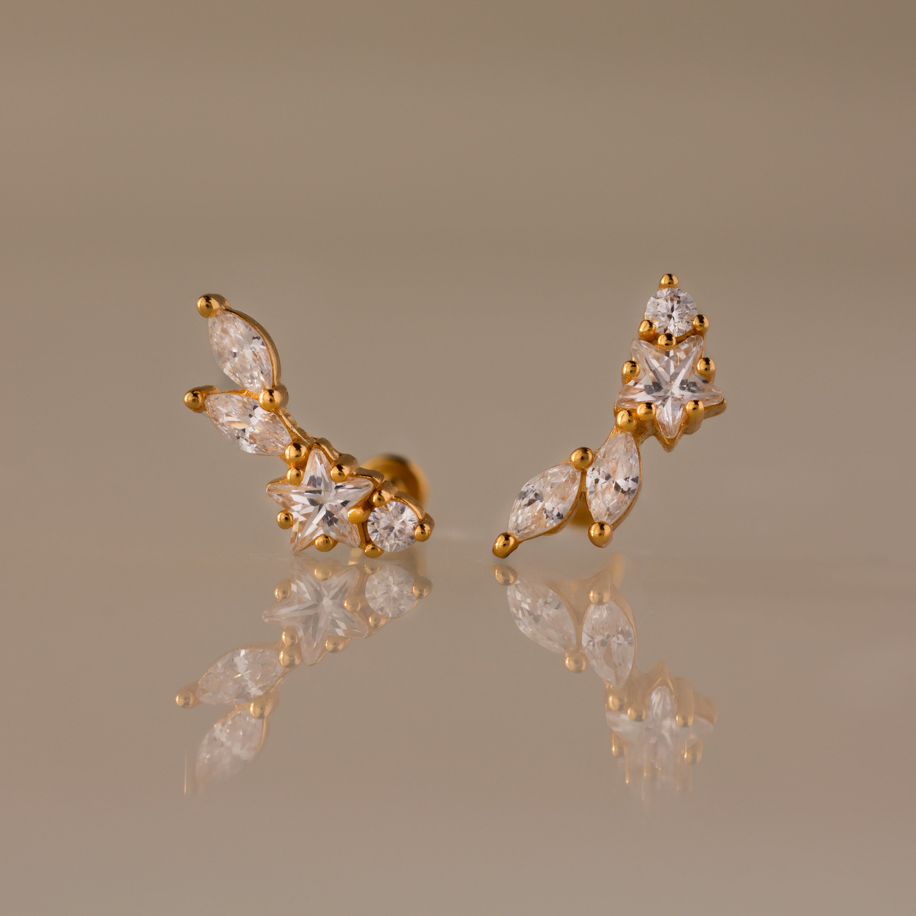 Diamond Starfall Climbers: Gold earrings featuring clear marquise-cut stones in a curved, delicate cluster for an elegant, radiant look.