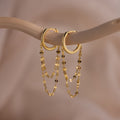 Duo Mirror Chain Huggies in 18K Gold feature double chain links, hanging elegantly—modern layered earrings ideal for those who love unique gold jewelry.