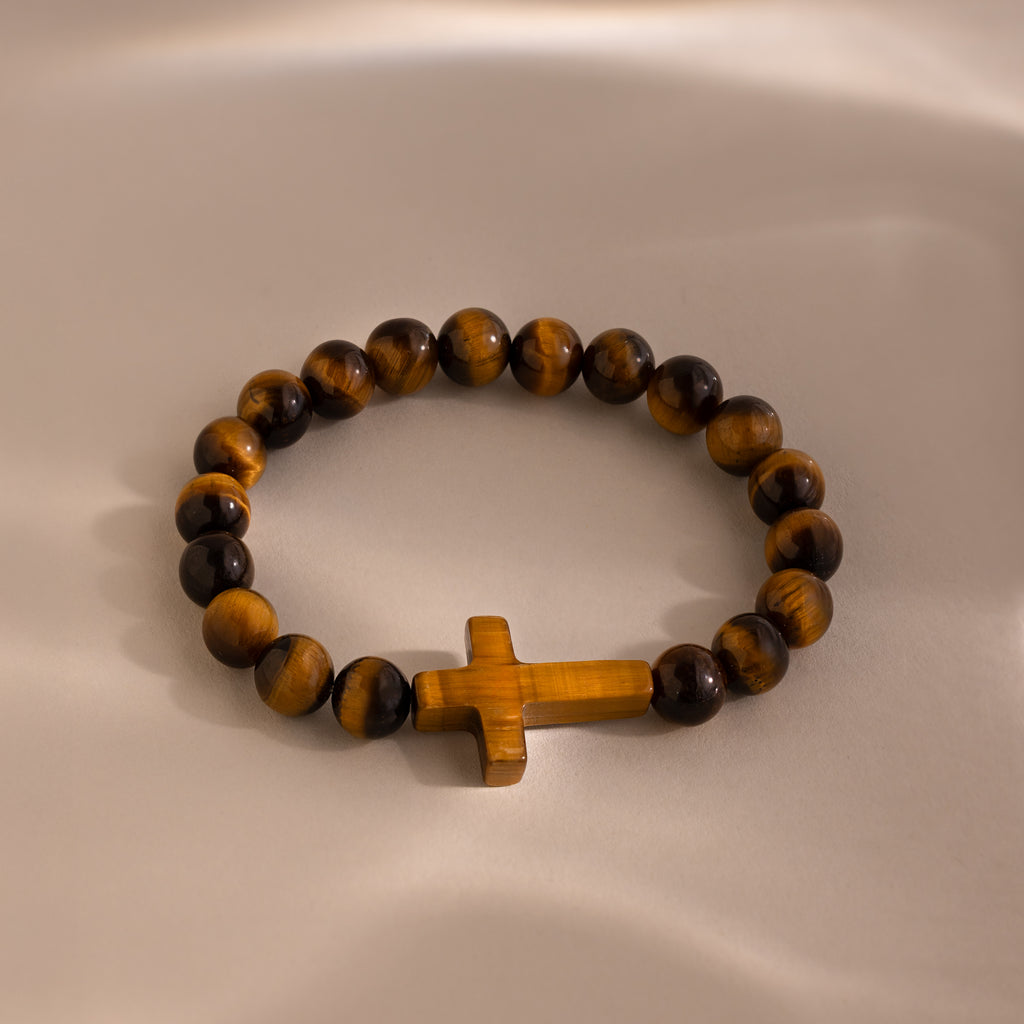 Tigers Eye Cross Bracelet featuring round polished tiger's eye beads and a horizontal tiger's eye cross charm, displayed on a neutral background.