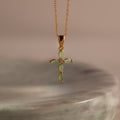 Gold chain necklace with a marquise jade stone cross pendant with a sparkling CZ diamond center.