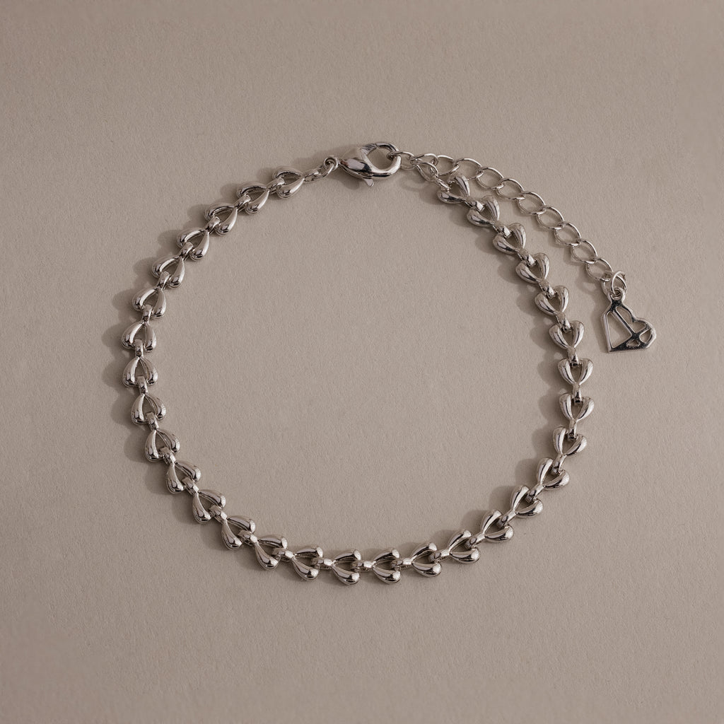 Silver Tiny Link Heart Bracelet displayed on a neutral background.