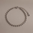 Silver Tiny Link Heart Bracelet displayed on a neutral background.