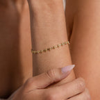 Model wearing a gold Dainty Mirror Chain Bracelet on her wrist.