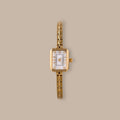 Divine Rectangular Link Timepiece with polished gold-tone case, white dial, and delicate link bracelet.