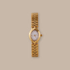 Flow Oval Link Timepiece: Gold-tone watch with petite oval dial and fluid multi-link bracelet.