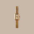 Gold-tone rectangular Harmony Link Timepiece with crystal markers and a polished finish.