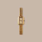 Gold-tone rectangular Harmony Link Timepiece with crystal markers and a polished finish.