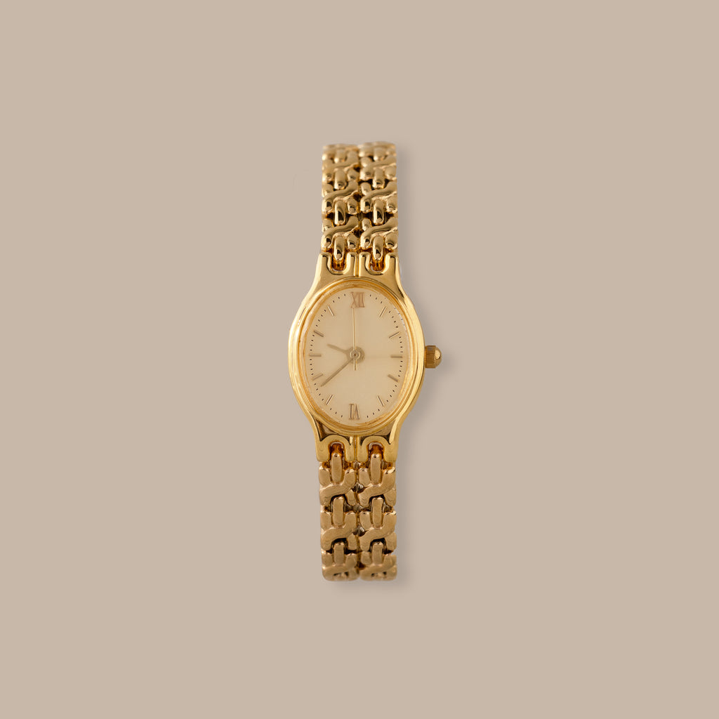 Elegant gold-tone Oval Duo Link Timepiece with an oval dial, Roman numerals, and delicate hour markers.