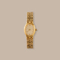 Elegant gold-tone Oval Duo Link Timepiece with an oval dial, Roman numerals, and delicate hour markers.