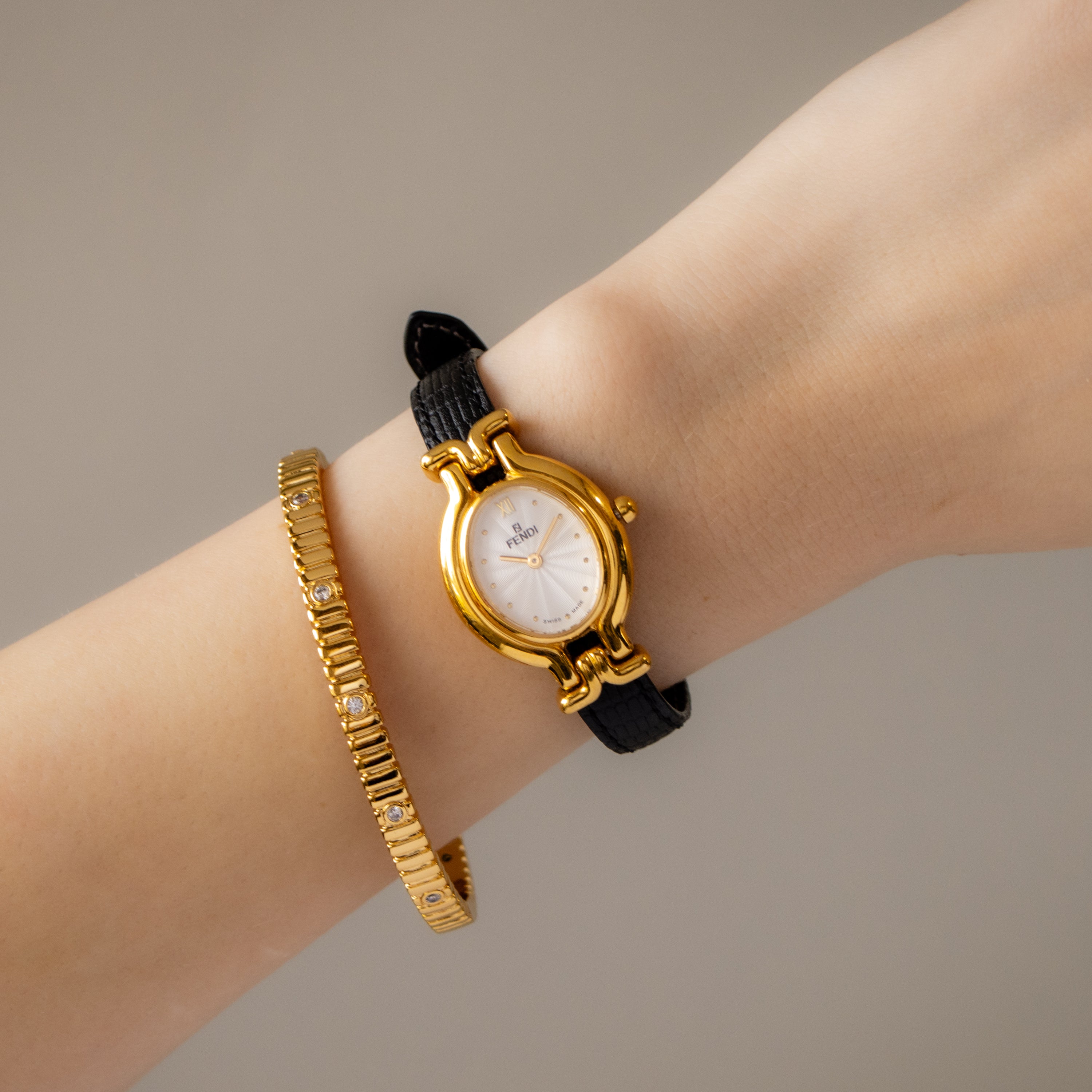 Vintage Fendi Swiss Oval Black Strap Gold Watch