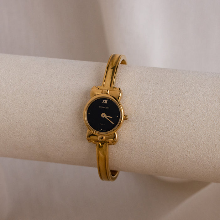 Vintage Swiss Nina Ricci Round Cuff Gold Watch