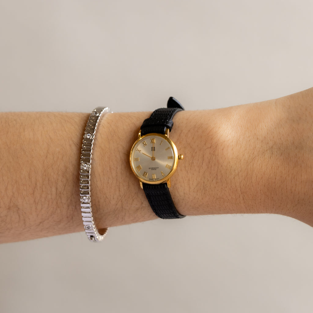 Vintage Givenchy Swiss Roman Black Strap Gold Watch