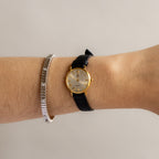 Vintage Givenchy Swiss Roman Black Strap Gold Watch