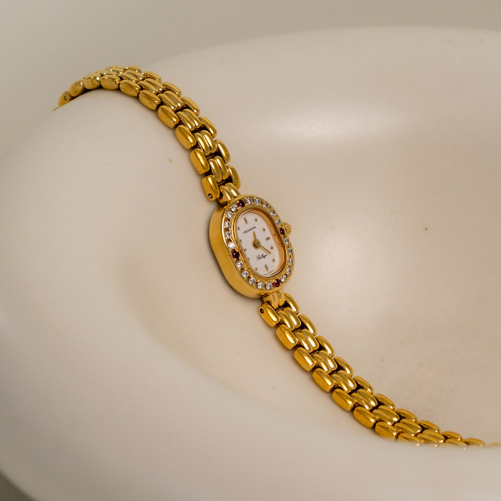 Vintage Technos Swiss Oval Pave Ruby Gold Watch
