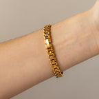 Vintage Technos Swiss Oval Pave Ruby Gold Watch