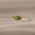 Marquise Jade Signet Ring with a marquise-shaped green jade stone shown on a neutral, softly lit background.