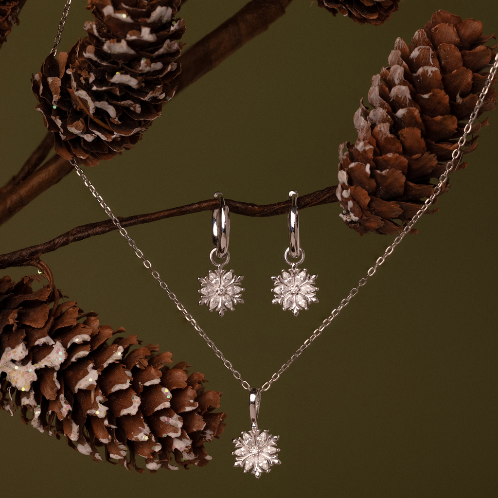 Flatlay of our Diamond Poinsettia Hoops & Necklace Jewelry Set
