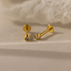 Clous d'oreilles à dos plat avec petite lunette en diamant