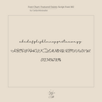 Sample of the Hallie Duo Initial Ring’s dainty script font, displaying uppercase, lowercase letters, and numbers on a beige background—perfect for personalized jewelry or an elegant gift for moms.