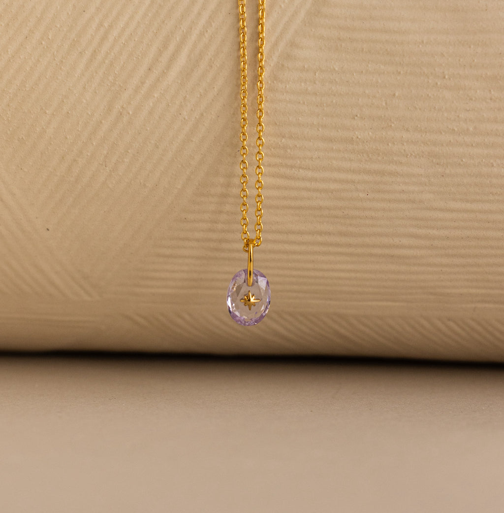 Up close of North Star Signet Birthstone Pendant Necklace in light purple alexandrite.