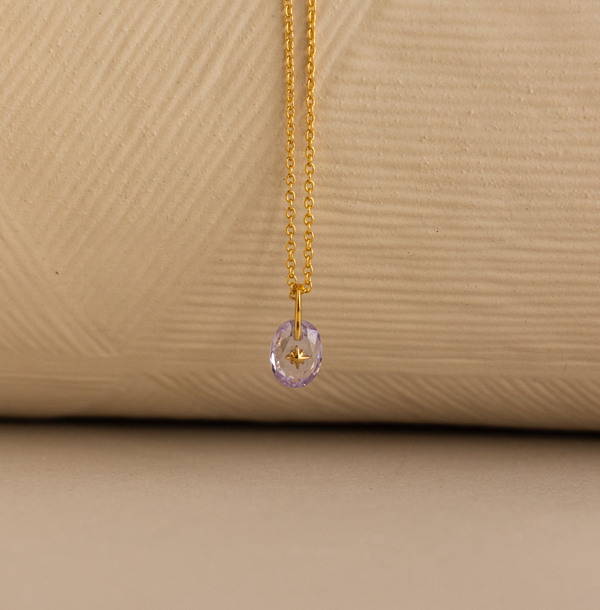 Up close of North Star Signet Birthstone Pendant Necklace in light purple alexandrite.