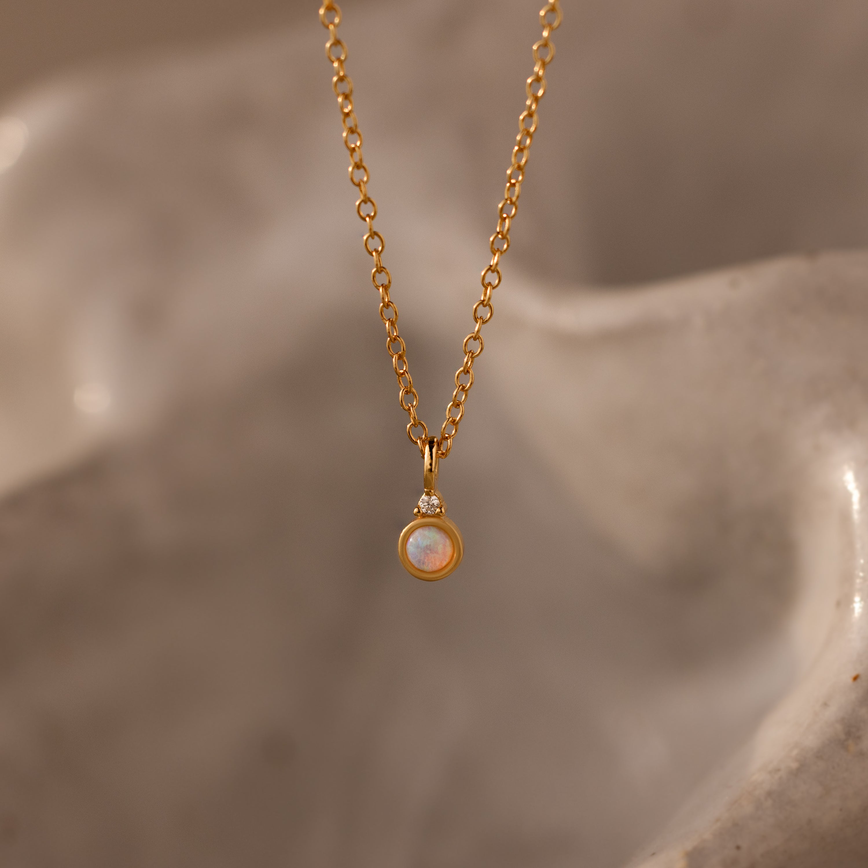 Close up of our Opal Diamond Necklace in Gold