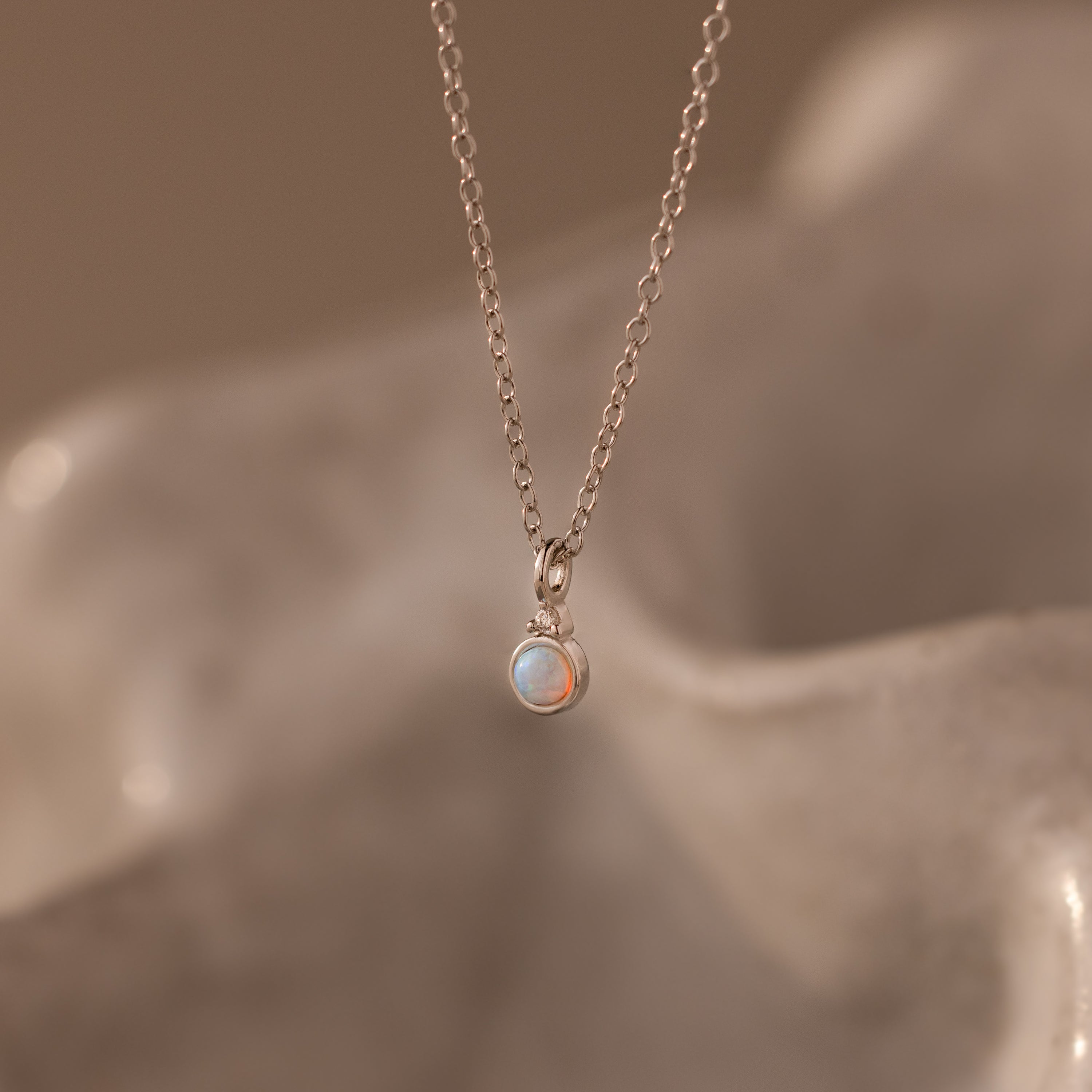 Close up our Opal Diamond Necklace in Silver