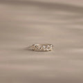 Close up of a dainty silver bubble letter ring with the name "GRACE".