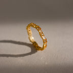 The Staggered Marquise Topaz Ring casts a shadow on a neutral background.