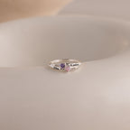 The Toi et Moi Interlocking Name Ring features two heart-shaped gemstones and engraved names, Elisa and Candice—a custom piece perfect for celebrating your unique bond.