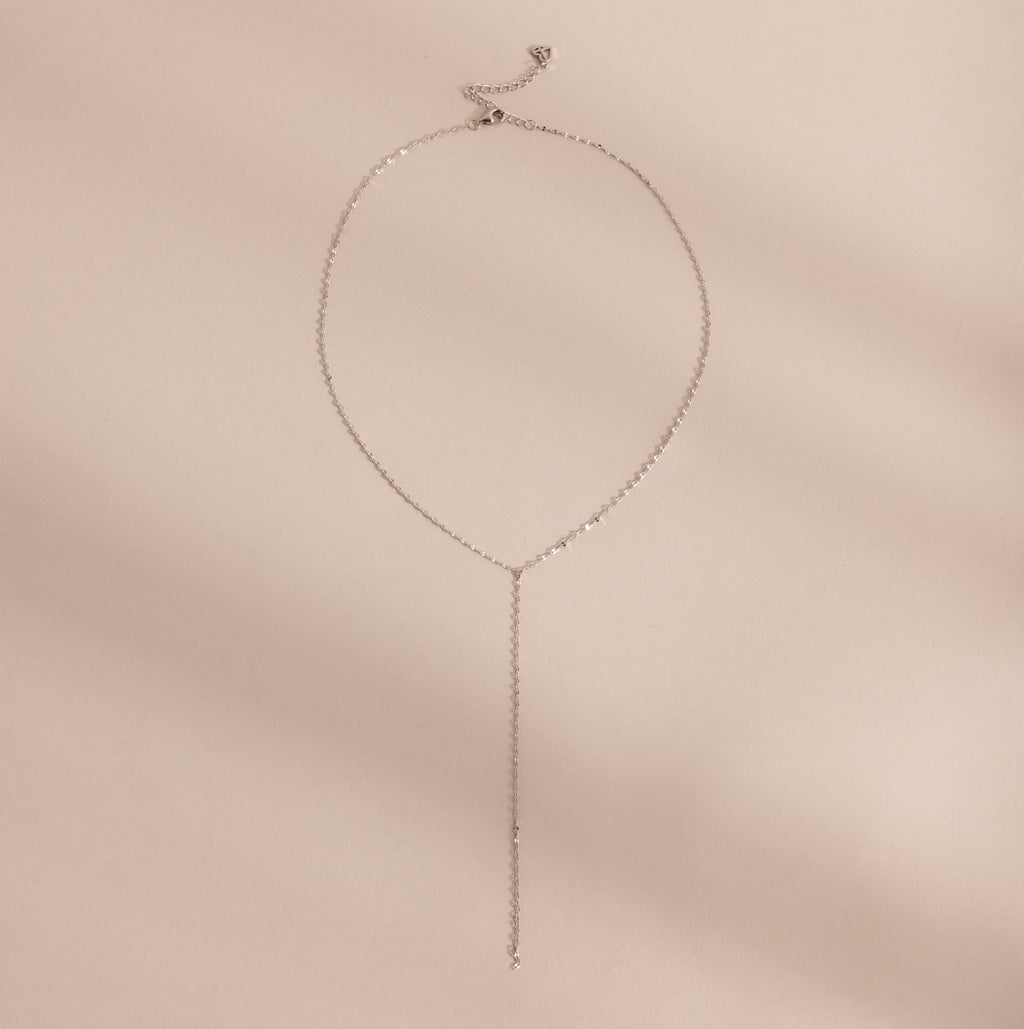 Silver mirror chain lariat necklace displayed on a neutral background.