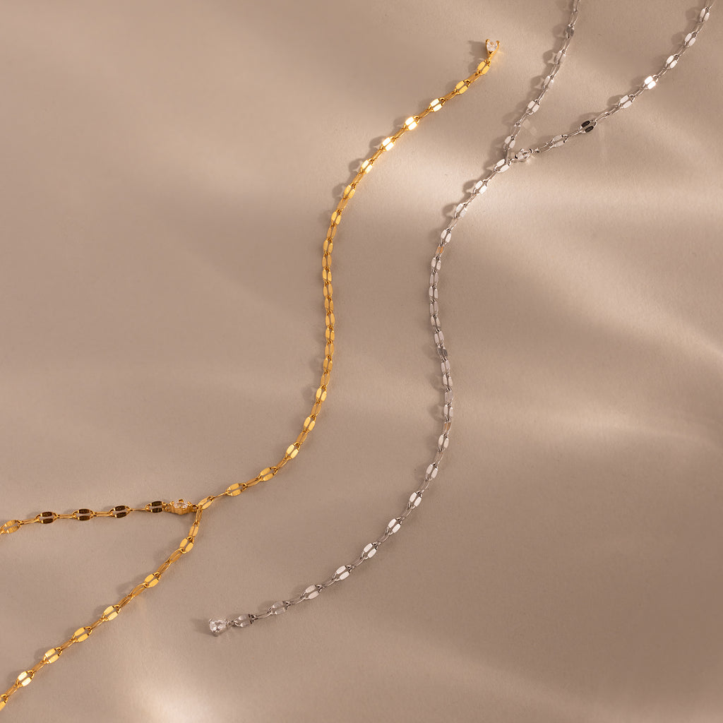 2 dainty Sparkling Diamond Lariat Necklaces in gold and silver, which feature a delicate mirror chain design with two CZ diamond stones.