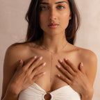 Far-view of model wearing a silver dainty Sparkling Diamond Lariat Necklace, which features a delicate mirror chain design with two CZ diamond stones.