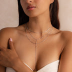 Model wearing a silver dainty Sparkling Layered Lariat Necklace, featuring 3 layers of mirror chain necklaces in varying lengths.