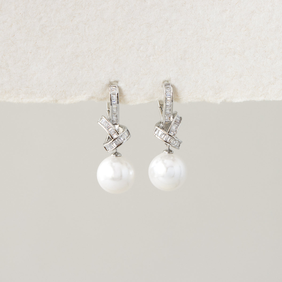 Diamond Knot Pearl Drop Earrings in Silver