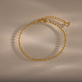 Dune Beaded Bracelet: gold polished beads with adjustable clasp and heart charm, ideal for layered looks—shown on a neutral background with soft shadows.