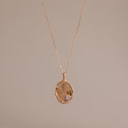 The Organic Fingerprint Multi Birthstone Necklace in Rose Gold features a unique textured charm with multiple sparkling stones on a delicate chain—an elegant, personalized jewelry piece perfect for any occasion.