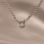 Close up of our Smoky Pearl Clasp Necklace in White Gold