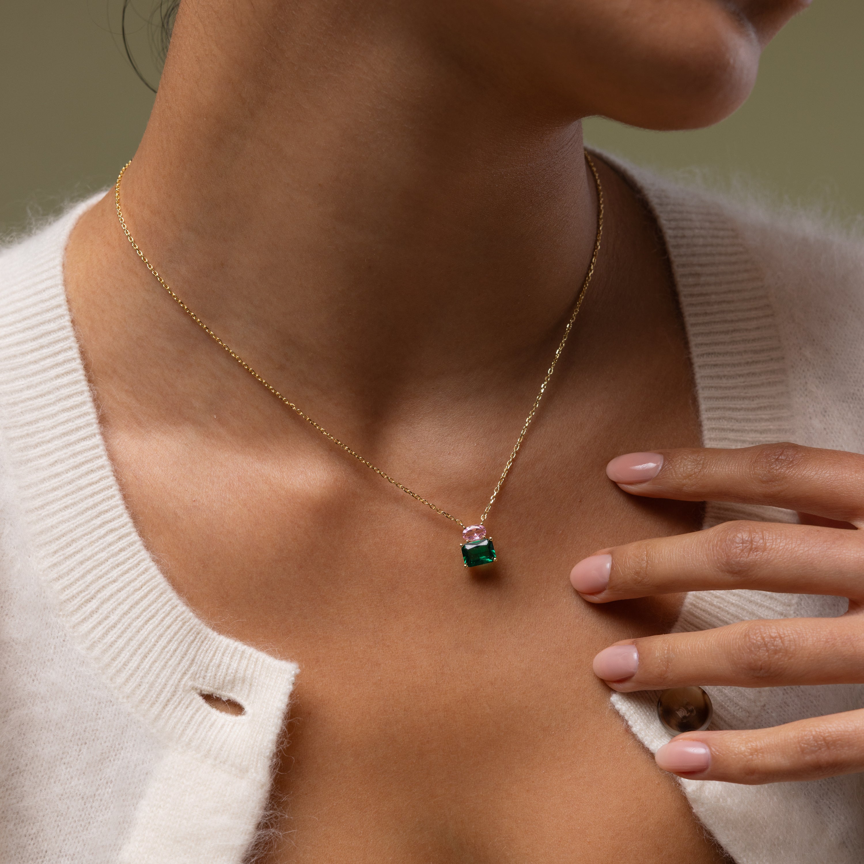 Close up of a model wearing our Emerald Bloom Necklace with Pink Tourmaline and Emerald Gemstones