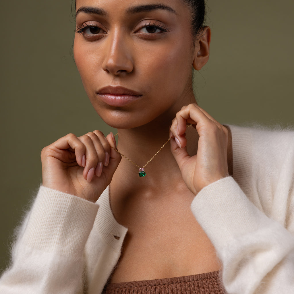 Model wearing our Emerald Bloom Necklace with Pink Tourmaline and Emerald Gemstones