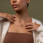 Model wearing our Emerald Bloom Necklace with Pink Tourmaline and Emerald gemstones.