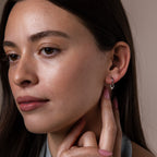 Model wearing our Tiny Teardrop Huggies in White Gold