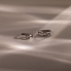 Close up flatlay of our Oval Duo Hoops in Sterling Silver