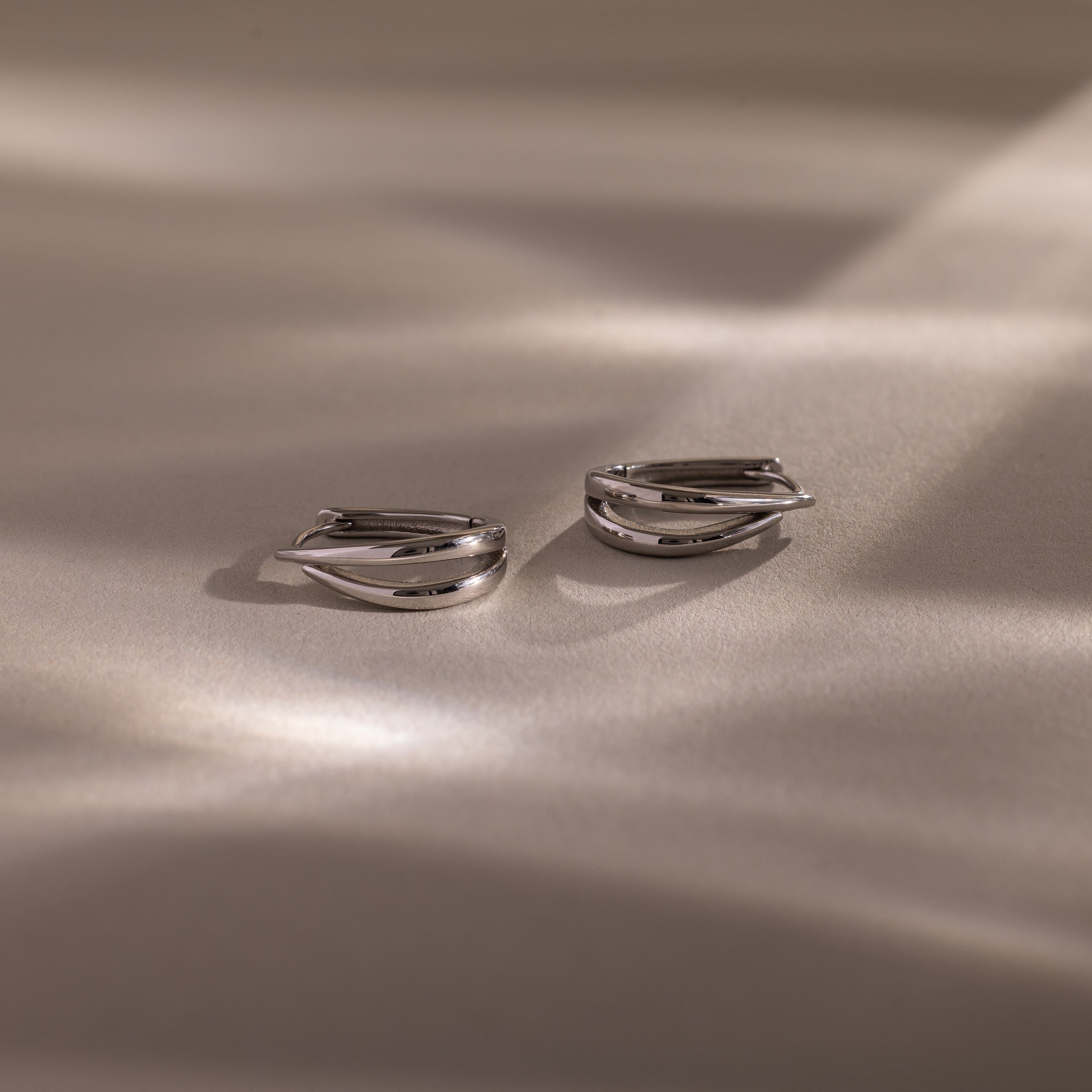 Close up flatlay of our Oval Duo Hoops in Sterling Silver